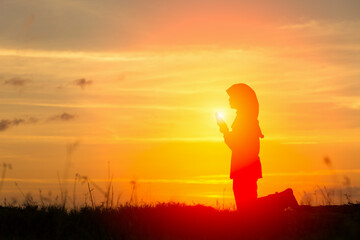 Silhouettes Muslim prayer,the light of faith, hope, faith, supplication,Muslim boy praying faith in Allah God of Islam supremely