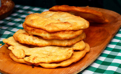 Deep fried flatbread stack on board