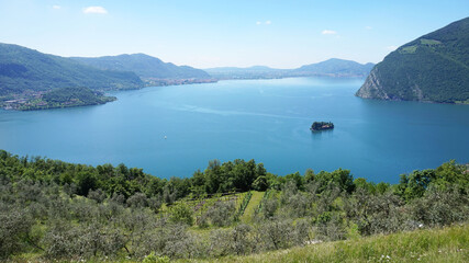 Lake panorama from "Monte Isola". Italian landscape. Island on lake. View from the island Monte Isola on Lake Iseo, Italy