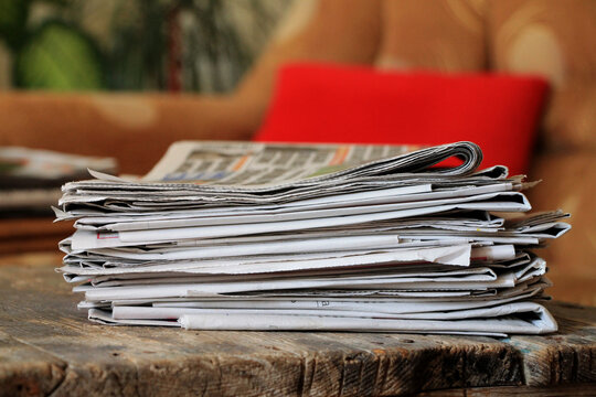 Newspapers on wooden table 