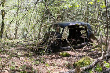 Abandoned car in French forest