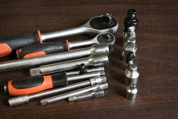 ratchet wrench lying on wooden table