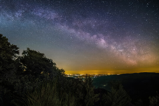 The Milky Way as seen from the summit of the hill Rahnfels in the Palatinate Forest near the city Bad Duerkheim in Germany.