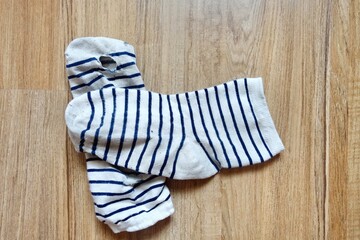 worn out old socks with hole.