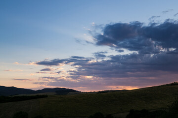 Sunset on meadow with hills and tree. Slovakia
