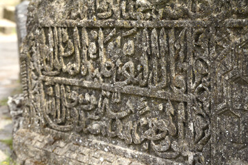 Arabian drawings and inscriptions are made on a very ancient stone