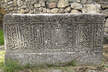 Arabian drawings and inscriptions are made on a very ancient stone