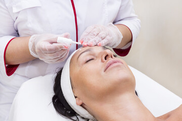 Process cosmetic mask of massage and facials in beauty salon 