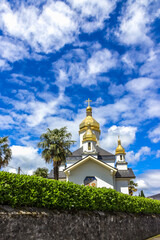 Ukrainian Church of the Virgin Dormition against the blue sky. France, Lourdes