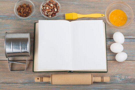 Blank Cookbook And Spices On Wooden Table.