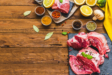 Obraz na płótnie Canvas Raw juicy meat steak on dark wooden background