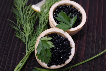 Black and red caviar for guests and friends.