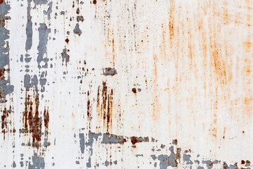 A background of peeling paint and rusty old metal
