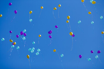  Group of floating balloons in the blue sky