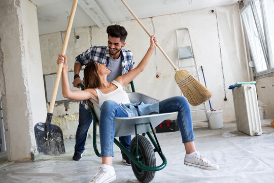 Loving couple is having fun while they are renovating house
