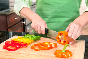 Woman Slicing Bell Peppers