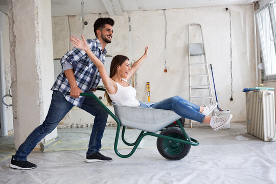Loving couple is having fun while they are renovating house