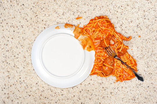 Dropped plate of spaghetti on carpet