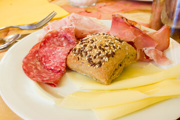 Salami sausages and bread with seeds at breakfast