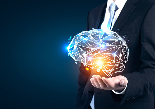 Businessman s hand holding holographic brain