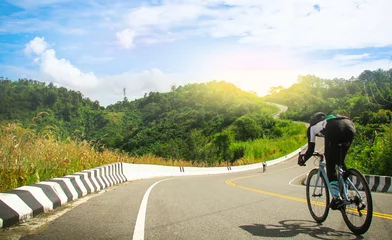 Foto auf Acrylglas women cycling mountain road bike in the morning © Rattanasak