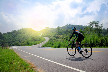 women cycling mountain road bike in the morning