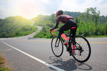 Fototapeta na wymiar women cycling mountain road bike in the morning