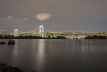 View rainbow bridge odaiba tokyo japan at night .