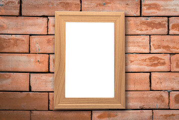 Mock up blank poster picture wooden frame on old brick wall in vintage tone with grass front ground.	