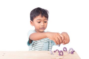 cute asian little boy play clay