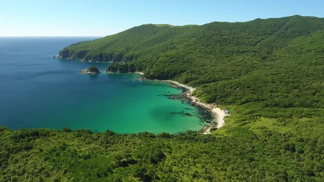 Azure water Bay of Languishing Heart. Far East Marine Biosphere Reserve, Primorsky Krai Vladivostok Russia. Unique National park Japan Sea. Aerial Helicopter Drone flight around high altitude. 4k