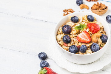 crunchy flakes with blueberries and various yogurts for healthy breakfast, close-up