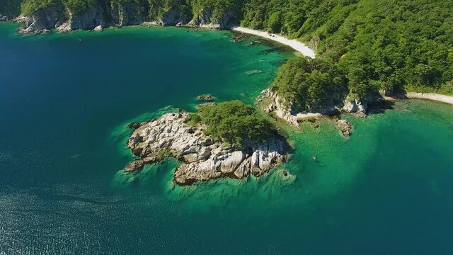 Famous tourist sightseeing Island of Languishing Heart. Far East Marine Biosphere Reserve Primorsky Krai Vladivostok Russia. Unique National park Japan Sea oean. Aerial Helicopter Drone flight. 4k