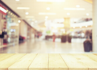 Blurred image of retail store in shopping mall for background.