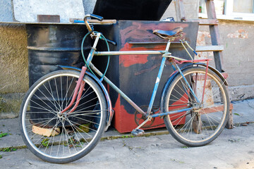 Fototapeta na wymiar Old abandoned bycicle