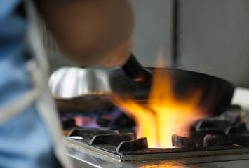 Chef use pan on gas stove