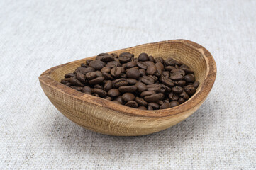 Fototapeta premium Natural coffee beans on a wooden board. 