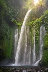 Layered water flows, cool air and green scenery are attractions that tourist can enjoy when they visit Tiu Kelep waterfall in Lombok, Indonesia.