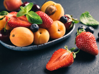 Ripe strawberry, apricot and blueberries