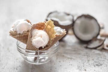 Vanilla-coconut ice cream in a waffle cone