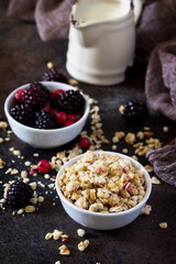 Healthy ingredients for breakfast. Homemade granola with fresh berries and yogurt.