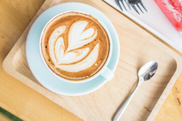 coffee heart cup on wood table in coffe shop cafe