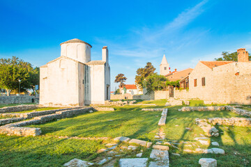 Fototapeta na wymiar Medieval church of Holy Cross from 9th century and archaeological site in historic town of Nin, Dalmatia, Croatia 