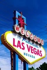 Foto op Plexiglas The Welcome to Fabulous Las Vegas sign on bright sunny day in Las Vegas.Welcome to Never Sleep city Las Vegas, Nevada Sign with the heart of Las Vegas scene in the background. © AmeriCantaro