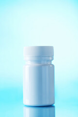 White cosmetic bottle on a blue background