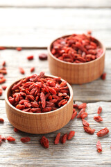 Dry goji berries on grey wooden table