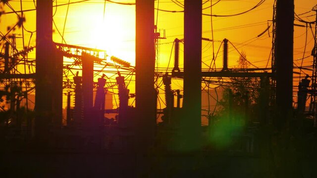 Electricity power station at a sunset, steadicam shot
