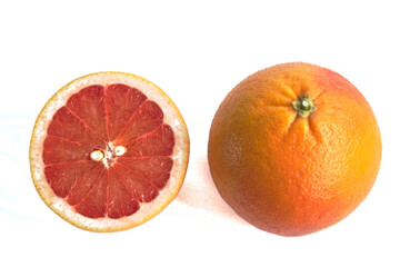 Closeup of red grapefruits on a white background