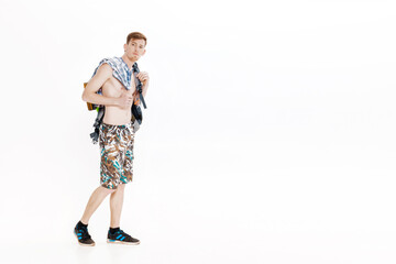 Fototapeta na wymiar Young hiker with backpack on white background