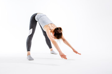 Young brunette engaged in yoga